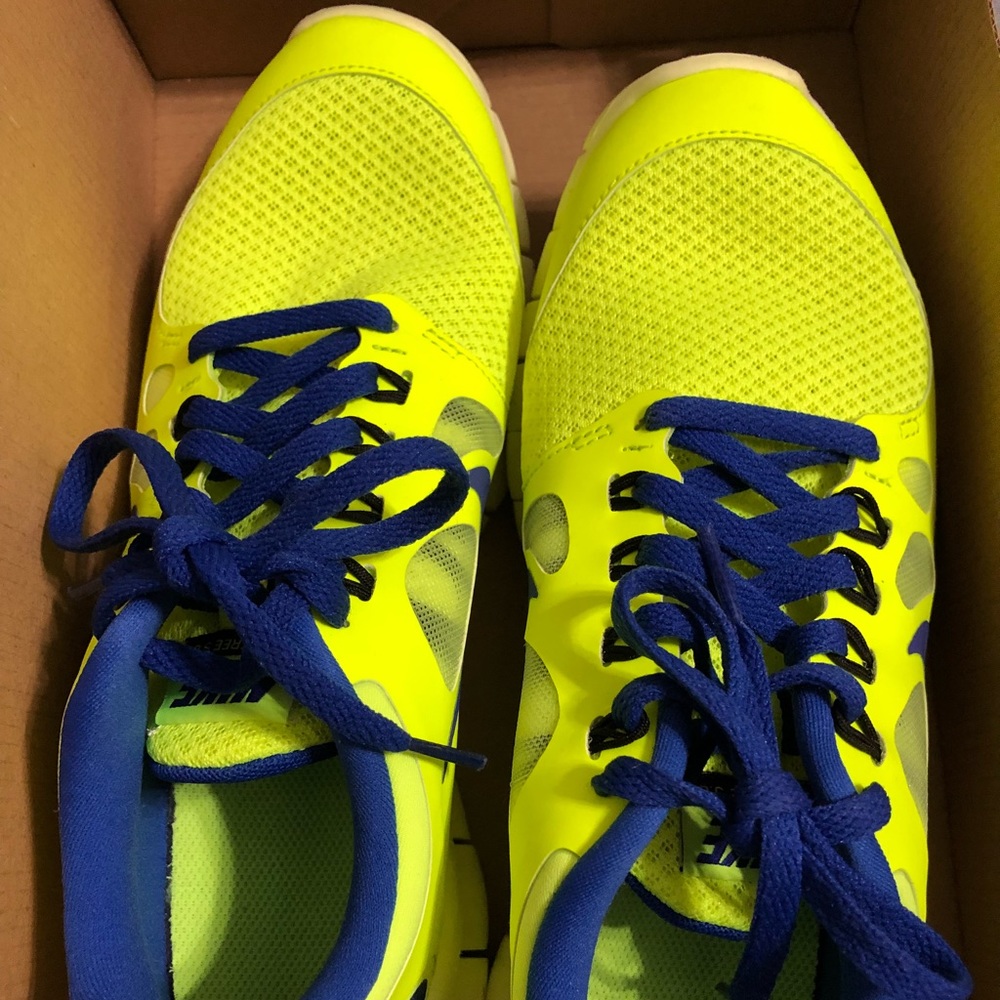 Nike size 6y neon yellow and blue fits 7.5 women